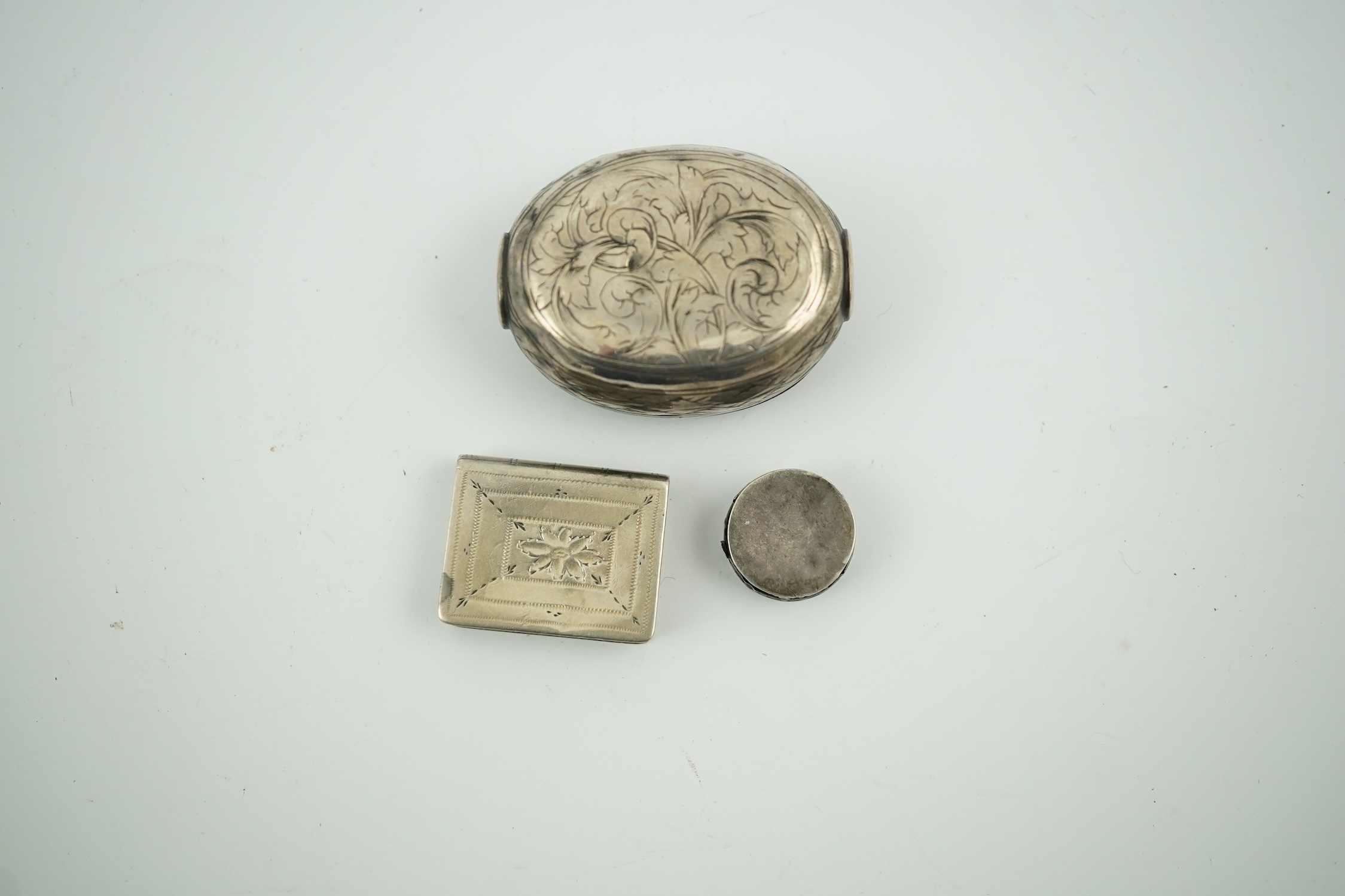 A 17th century style miniature silver snuff box, 40mm, a miniature 'book' box and a token/counter box with one counter. Condition - poor to fair